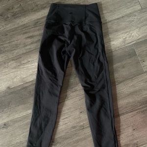 Lululemon black leggings with details on legs